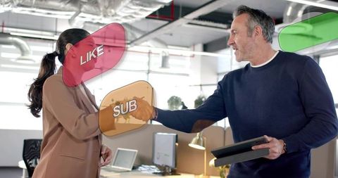 Shaking hands in modern open-plan office business greeting professional collaboration