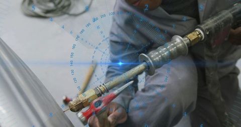 Industrial welder cutting curved steel pipe with precision torch and clamp