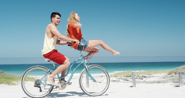 Happy Couple Enjoying Bike Ride on Sunny Beach Day - Download Free Stock Images Pikwizard.com