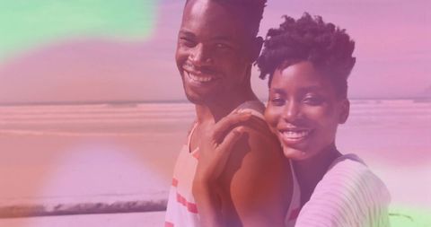 Romantic Couple Enjoying Beach with Dreamy Pastel Overlay