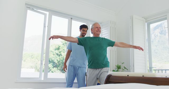 Senior Man Exercising with Caregiver Assistance at Home - Download Free Stock Images Pikwizard.com