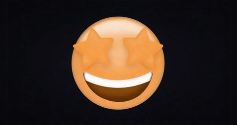 Vibrant emoji with star eyes and smiling mouth on black backdrop