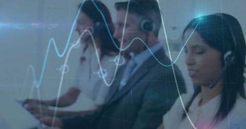Customer service agents monitoring real-time analytics and dashboards in call center team