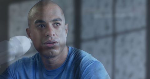 Tired athlete cooling down after intense workout