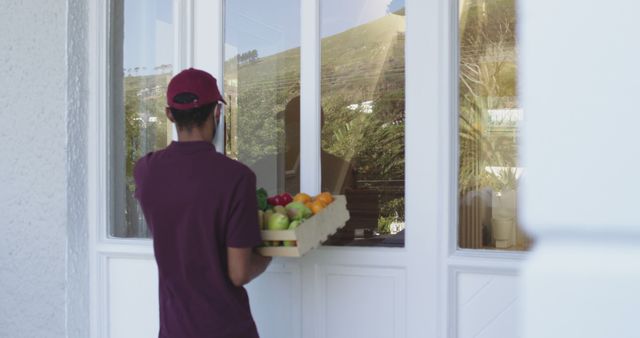 Grocery Delivery Person At Front Door Delivering Fresh Produce - Download Free Stock Images Pikwizard.com