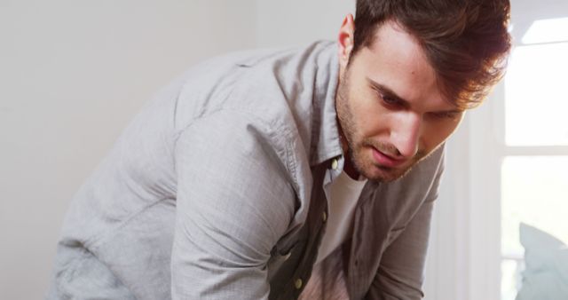 Focused Man in Thought While Working Indoors - Download Free Stock Images Pikwizard.com