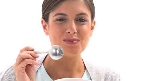Woman Enjoying Healthy Fruit Salad with a Wink