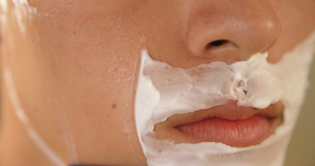 Close-up of Person Shaving with Shaving Cream on Face - Download Free Stock Images Pikwizard.com