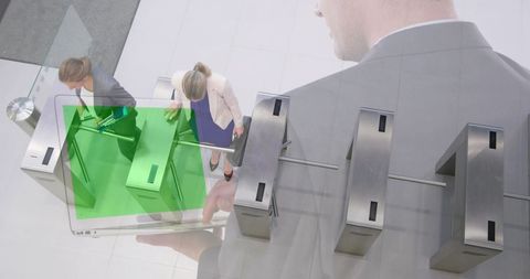 Businessman Using Green Screen Laptop Overseeing Modern Turnstile Entry