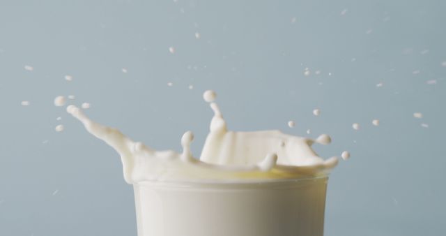 Image of glass of milk with copy space on blue background. dairy products and healthy organic nutrition.