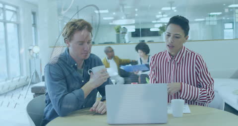 Animated Data Overlayed on Colleagues in Modern Office Setting