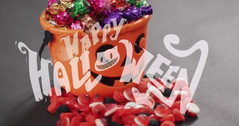Festive Halloween Candy and Pumpkin Bucket Celebration - Download Free Stock Images Pikwizard.com