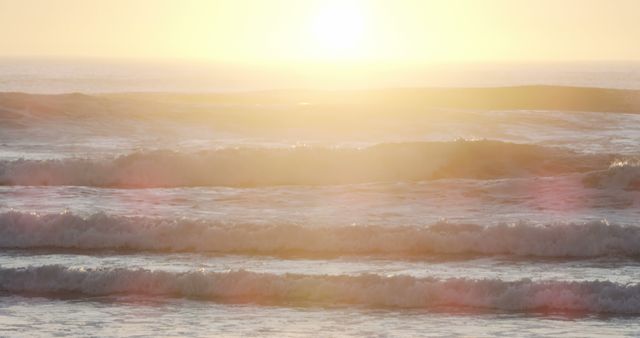 Golden Sunrise Over Ocean Waves Creating a Serene Atmosphere - Download Free Stock Photos Pikwizard.com