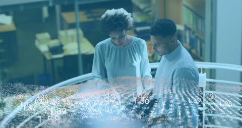 Diverse Colleagues Analyzing Digital Data Interface in Modern Office