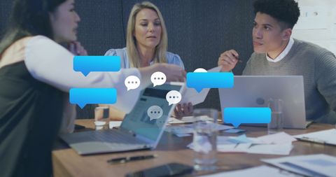 Diverse Team Discussing Ideas with Digital Speech Bubbles