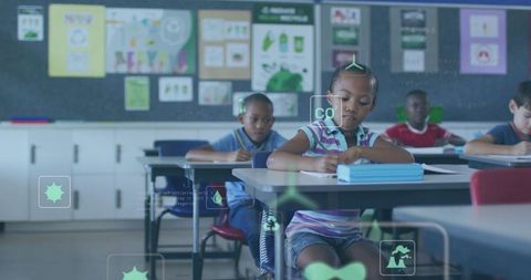 Elementary student writing and focusing on workbook with CO2 monitor overlay in classroom