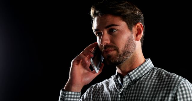 Man Talking on Smartphone in Dark Background - Download Free Stock Images Pikwizard.com