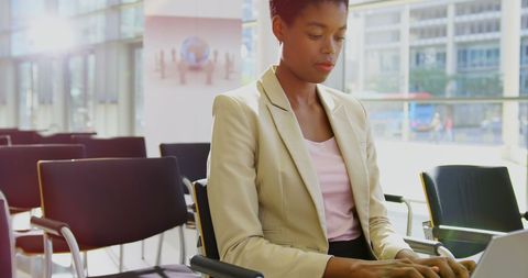 Professional Businesswoman Working on Laptop in Seminar Room - Download Free Stock Images Pikwizard.com