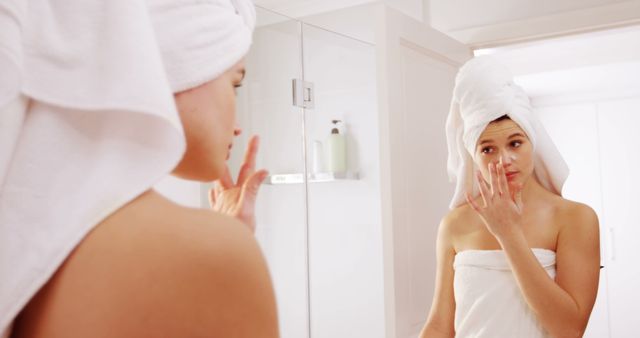 Woman Applying Skincare Cream After Shower - Download Free Stock Images Pikwizard.com