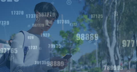 Man Using Cellphone with Digital Data Overlay