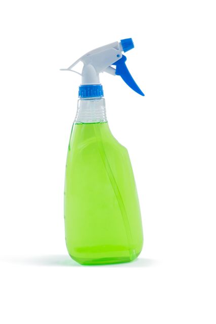Close-up of spray bottle against white background