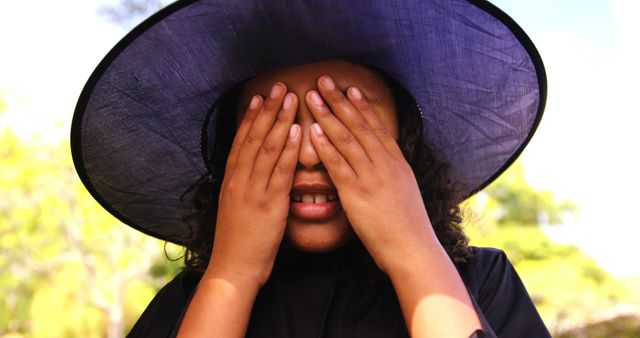 Young Girl Covering Eyes with Hands Dressed as Witch - Download Free Stock Images Pikwizard.com