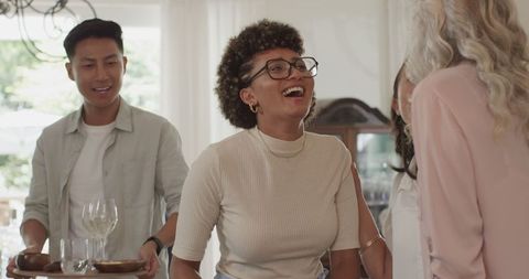 Group Enjoying Relaxed Gathering with Laughter and Delight