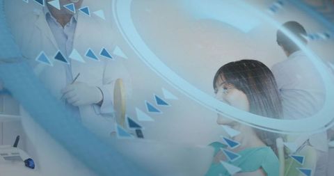 Dentist examining patient in dental chair with digital overlay depicting high-tech diagnostics