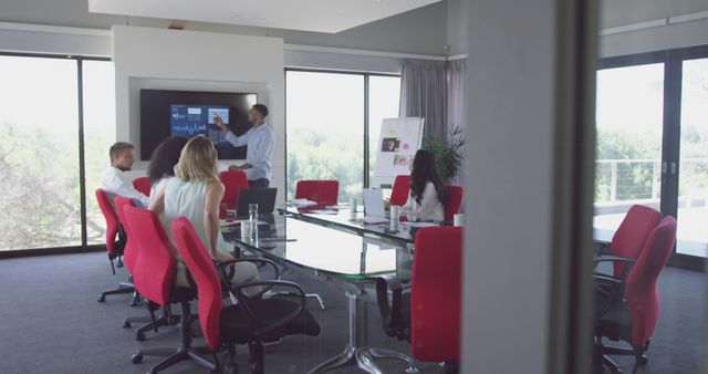 Business team in meeting room discussing presentation ideas - Download Free Stock Images Pikwizard.com