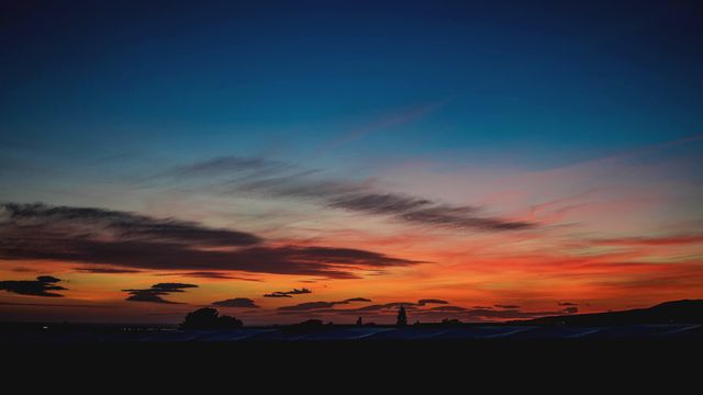 Stunning Sunset with Vibrant Sky and Dark Silhouettes - Download Free Stock Photos Pikwizard.com