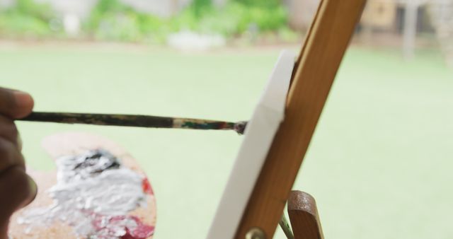 Close-up of Artist Painting on Easel in Outdoor Garden - Download Free Stock Images Pikwizard.com