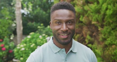 Smiling African American Man in Garden, Relaxed Outdoor Scene - Download Free Stock Images Pikwizard.com