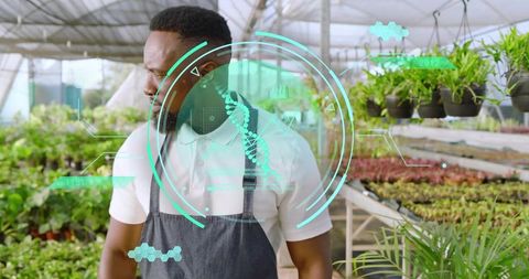 Greenhouse Technician Inspecting Seedlings with DNA HUD Overlay for Precision Horticulture