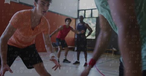 Basketball players practicing defensive drill and teamwork with binary data overlay