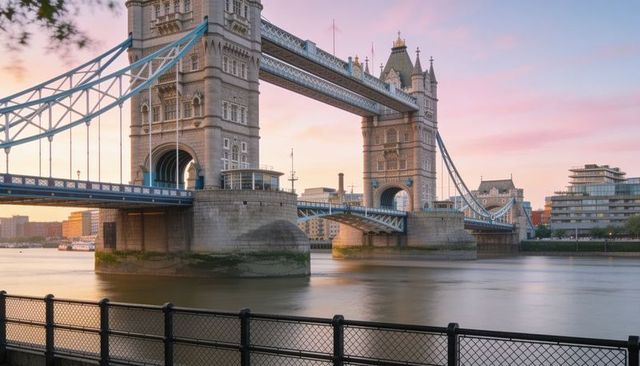 Tower bridge at sunset: historic bascule and suspension span over river thames, pastel sky