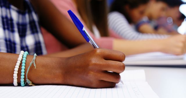 Students Writing in Notebooks During Classroom Activity - Download Free Stock Images Pikwizard.com