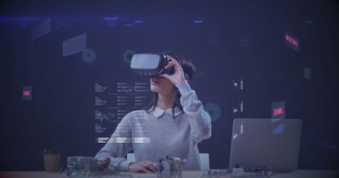 Woman engaging with virtual reality in tech environment
