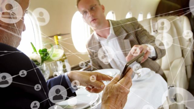 Visual representation of business professionals networking on a private jet with digital icons suggesting global connections. Ideal for depicting corporate communication, technology integration in business, and executive travel. Useful for articles, presentations, and advertisements relating to business networking, technological advancement in business, and corporate travel.