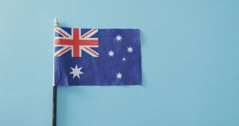 Australian flag against light blue background symbolizing patriotism