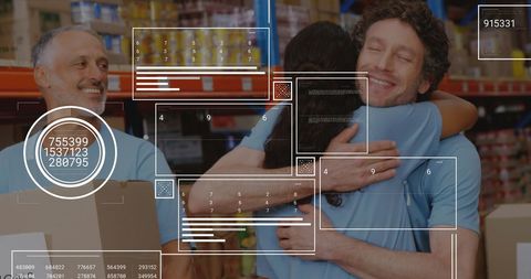 Volunteers Embrace in Warehouse with Data Visualization