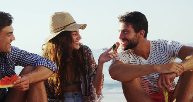 Friends Enjoying Watermelon Together At Sunny Beach - Download Free Stock Images Pikwizard.com