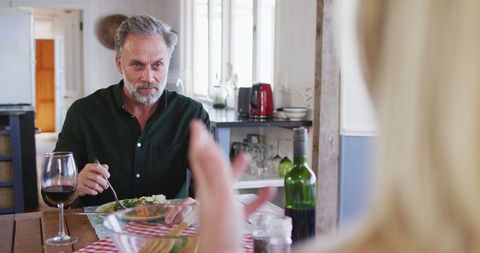 Mature Couple Enjoying Romantic Dinner at Home