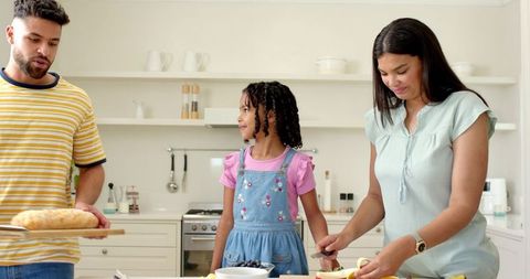Diverse Family Enjoying Breakfast Preparation Together in Modern Kitchen