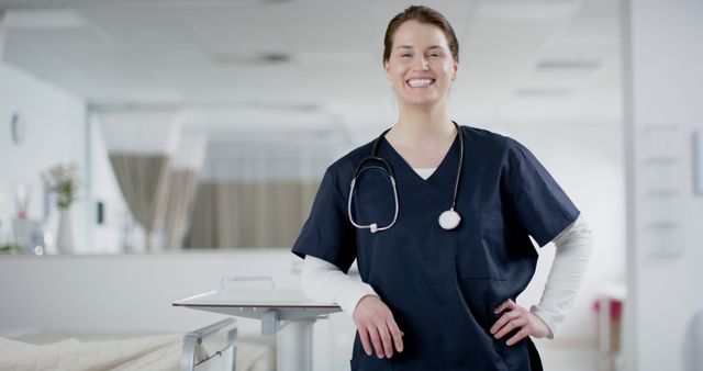 Confident Nurse in Hospital Setting Standing and Smiling - Download Free Stock Images Pikwizard.com