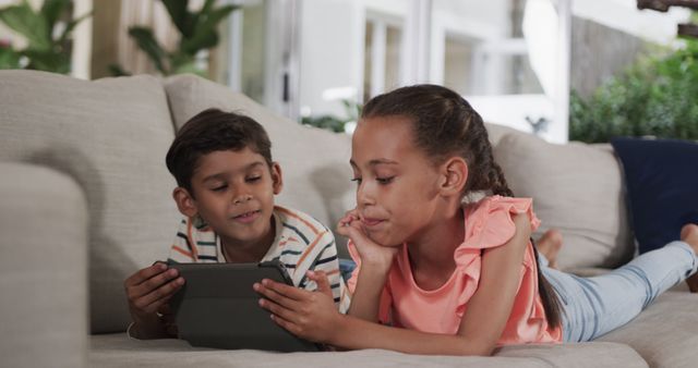 Children Playing on Tablet Together at Home - Download Free Stock Images Pikwizard.com