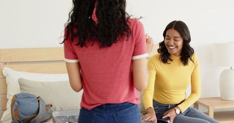 Family Vacation Preparation with Smiling Mother and Daughter