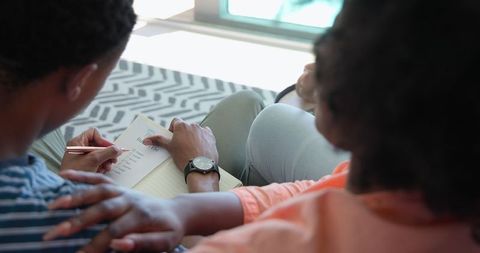 Couple Relaxing Indoors Reading and Connecting