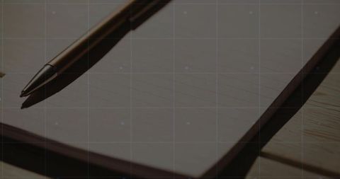 Metallic Ballpoint Pen on Lined Notebook in Minimal Workspace