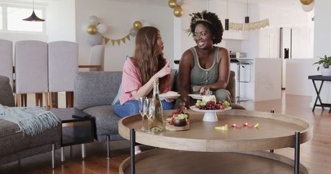 Joyful Lesbian Couple Celebrating Birthday at Home