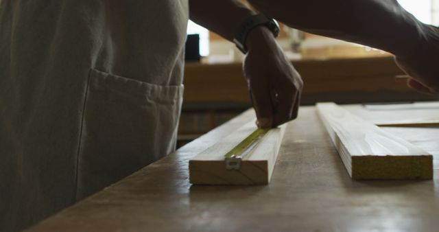 Craftsman Measuring Wood in Workshop - Download Free Stock Images Pikwizard.com